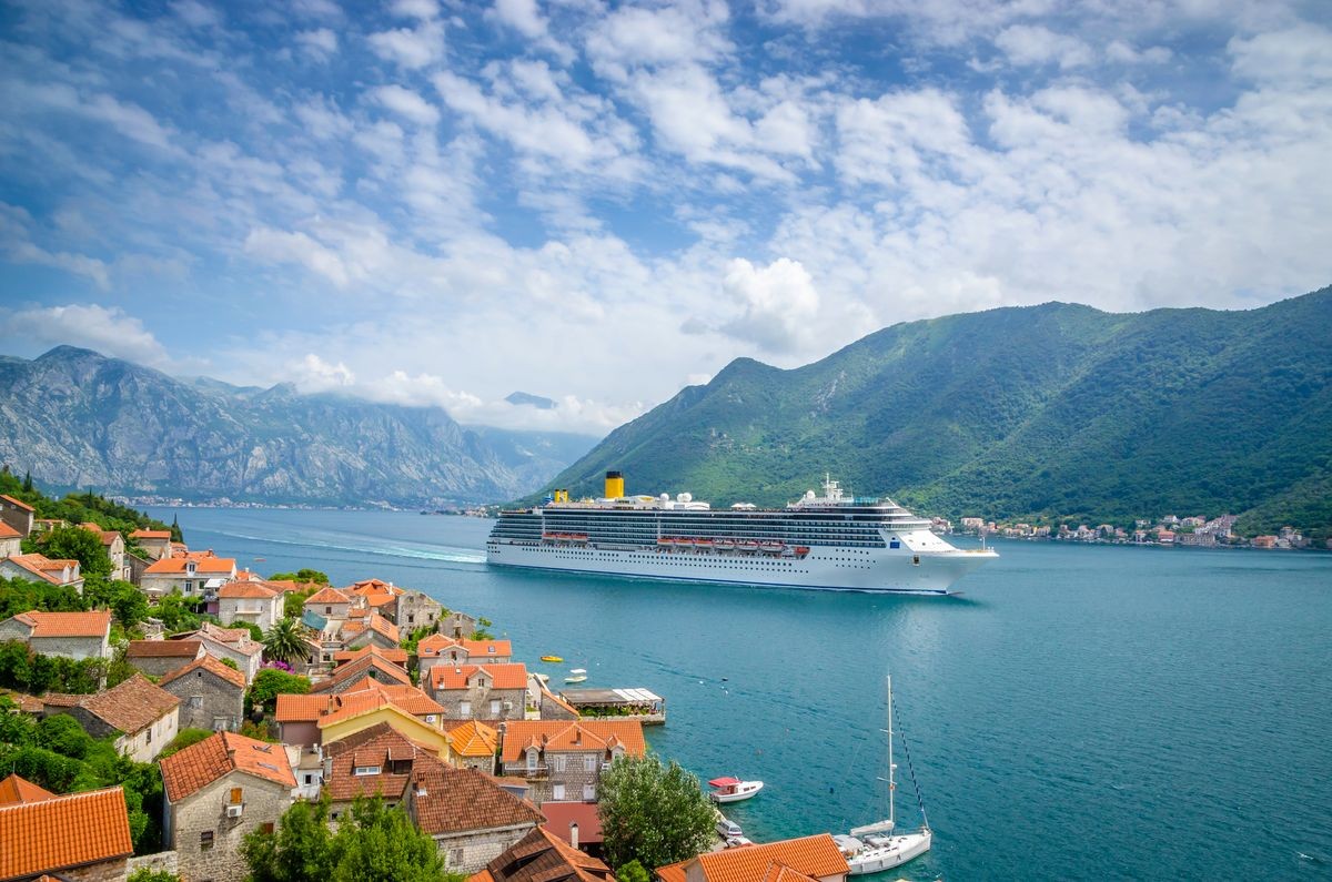 Beautiful mediterranean landscape. Cruise ship near town Perast, Montenegro.